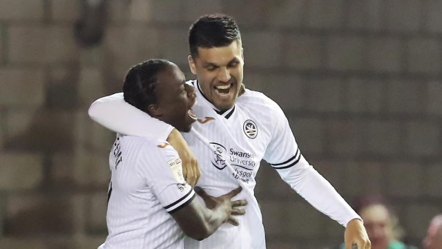 Joel Piroe celebrates with Michael Obafemi